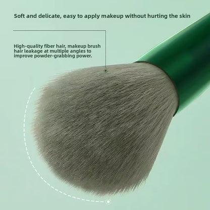A set of thirteen makeup brushes